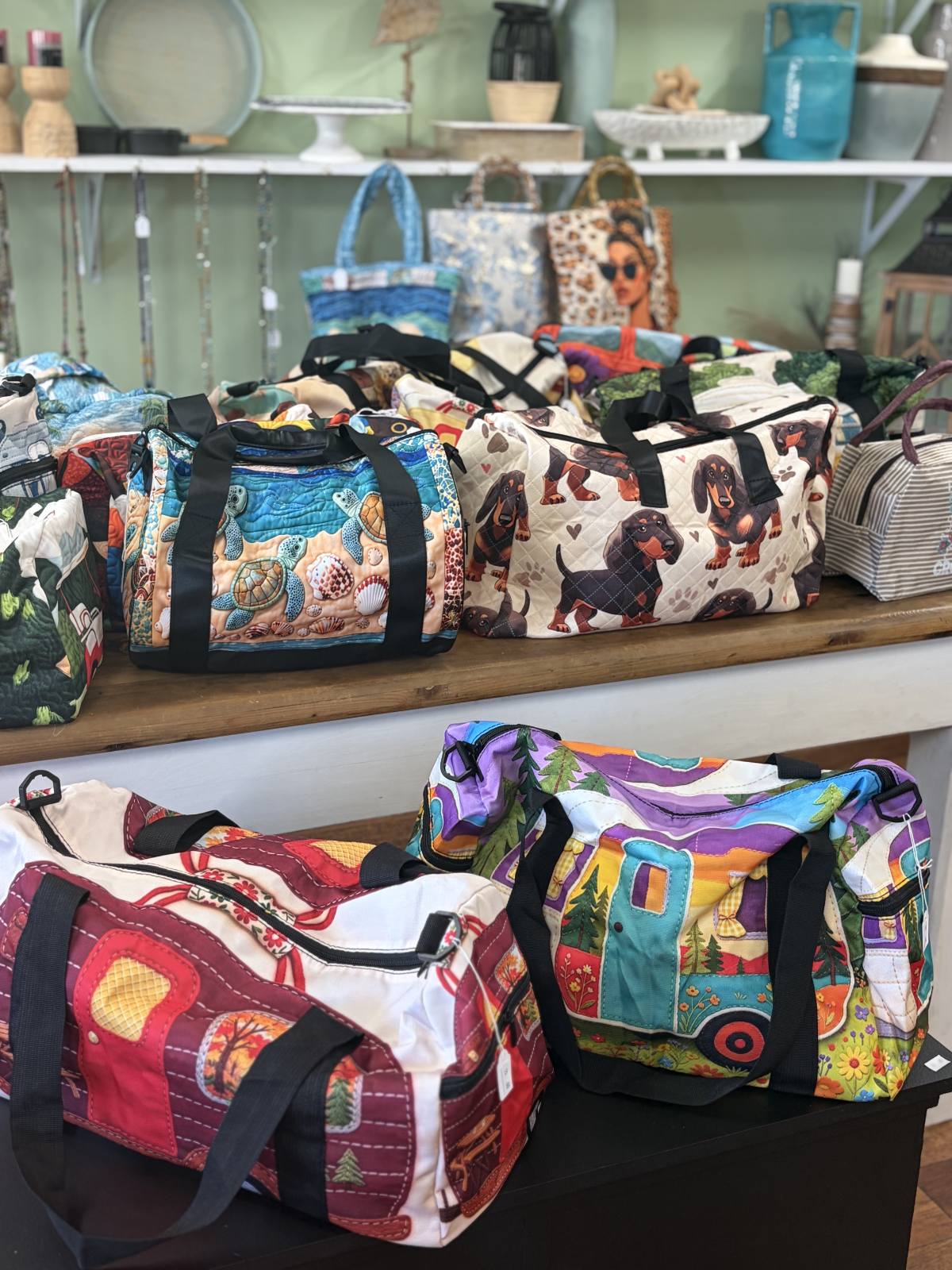A selection of colourful bags with turtle, dachshund and caravan prints