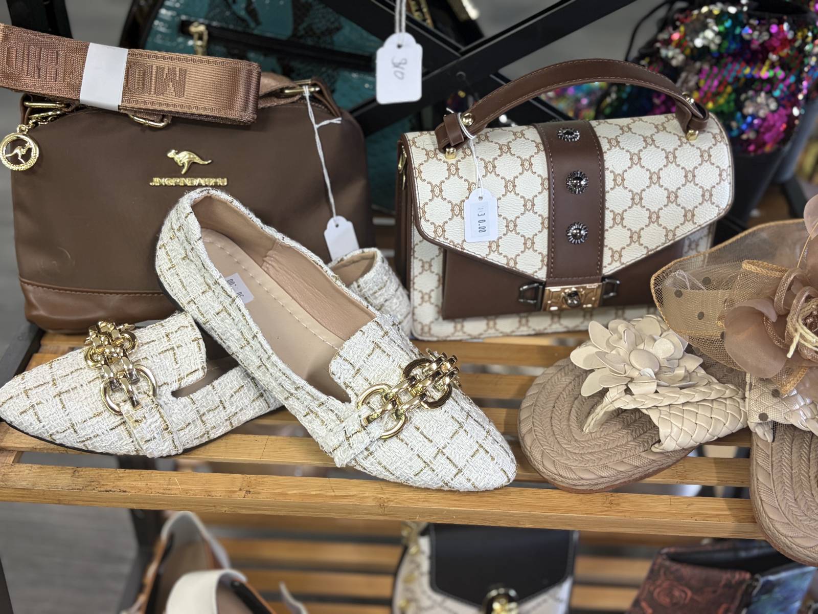 Cream pointed shoes, brown handbags and floral sandals