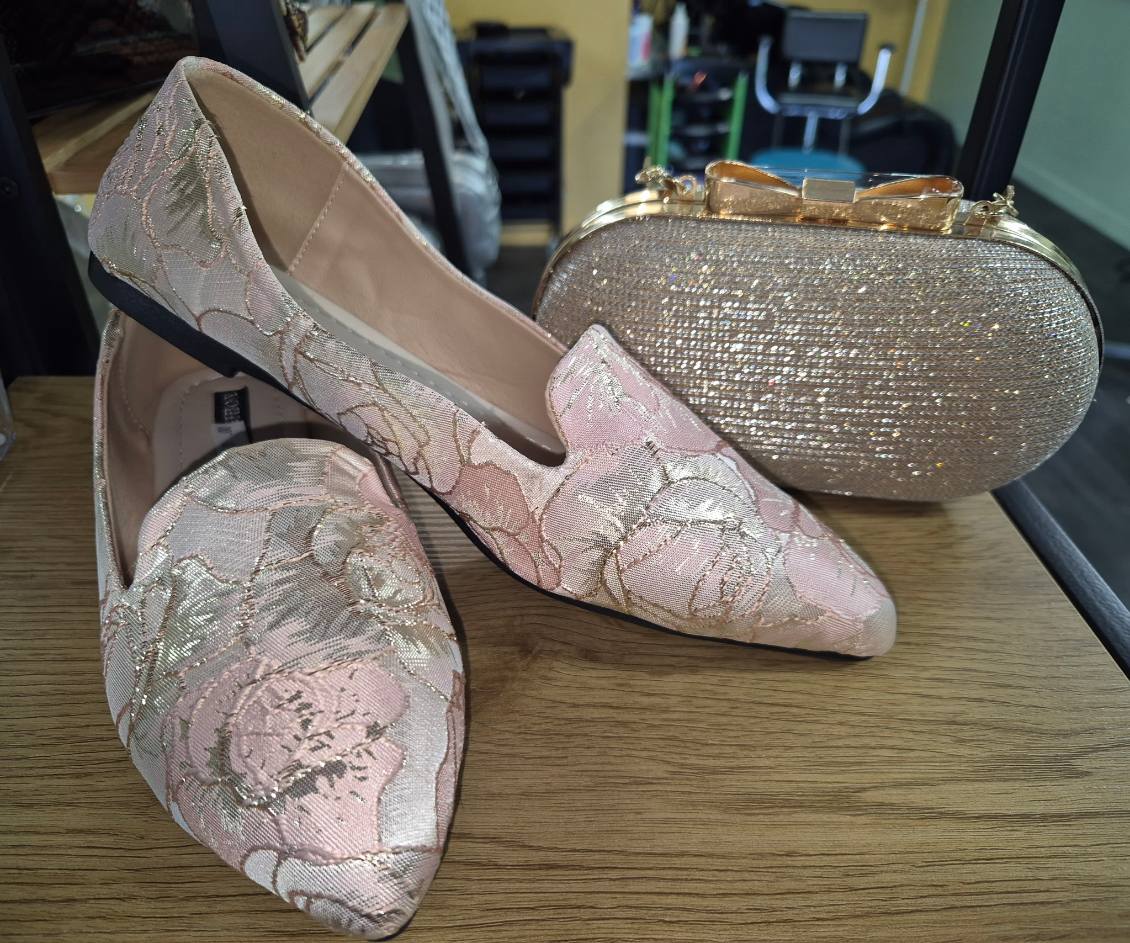 Pink and gold floral shoes with a sparkling gold clutch bag