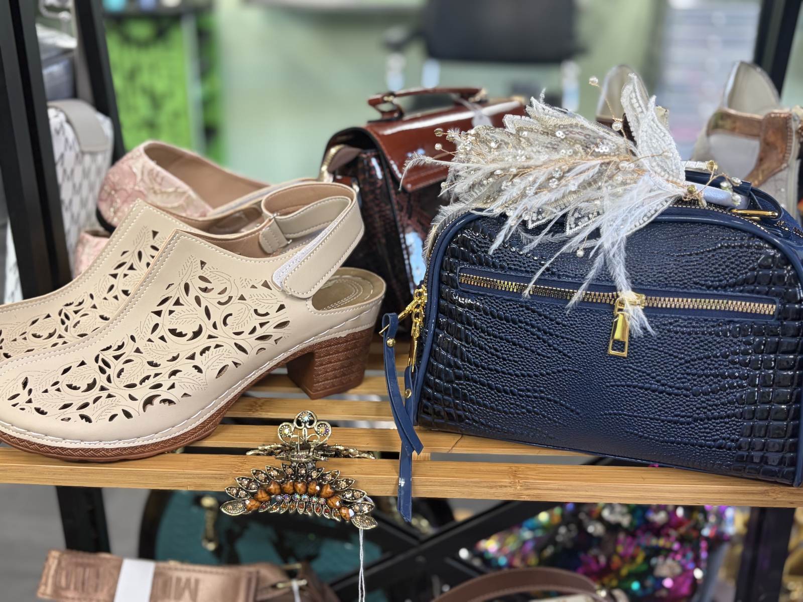 Navy handbag, cream cut-out shoes and decorative hair accessories