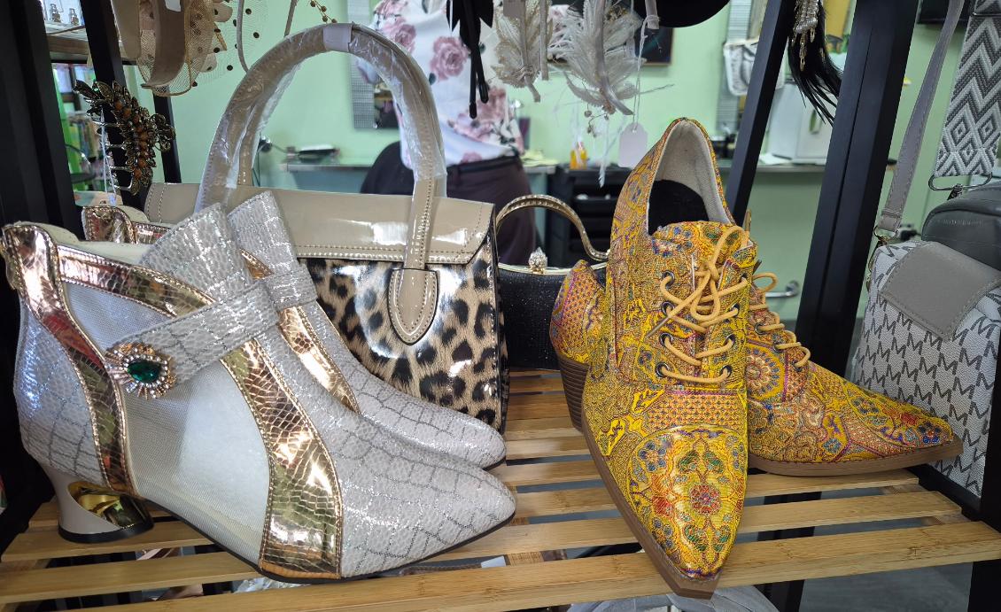 Silver ankle boots, yellow patterned lace-up shoes and handbags